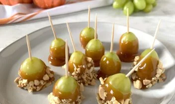 green grapes dipped in caramel and crushed peanuts